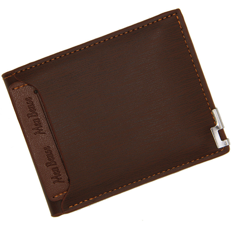 Brown leather wallet with a visible brand name on a white background